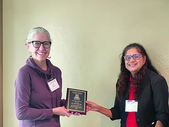 Photo of Jean McClain with Award